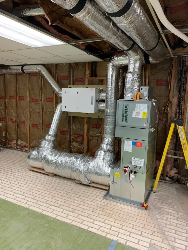 A large air handler is installed in the basement.