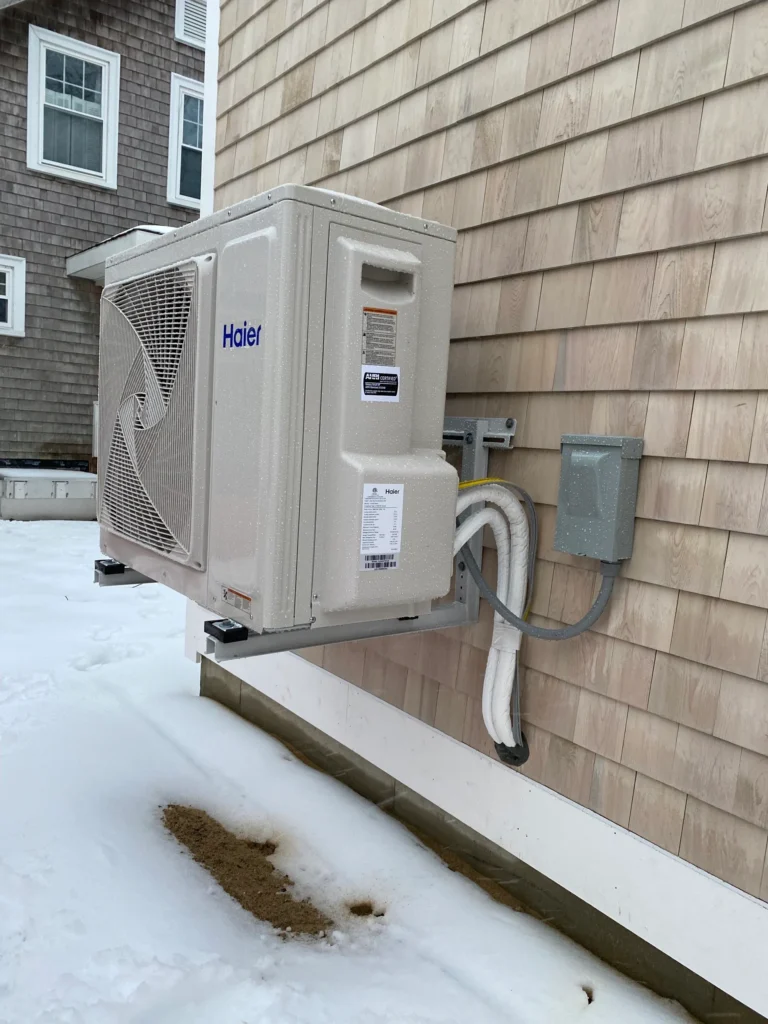 A heat pump mounted on the side of a building.