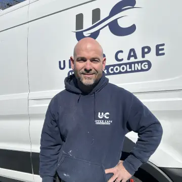 A man standing in front of a truck.